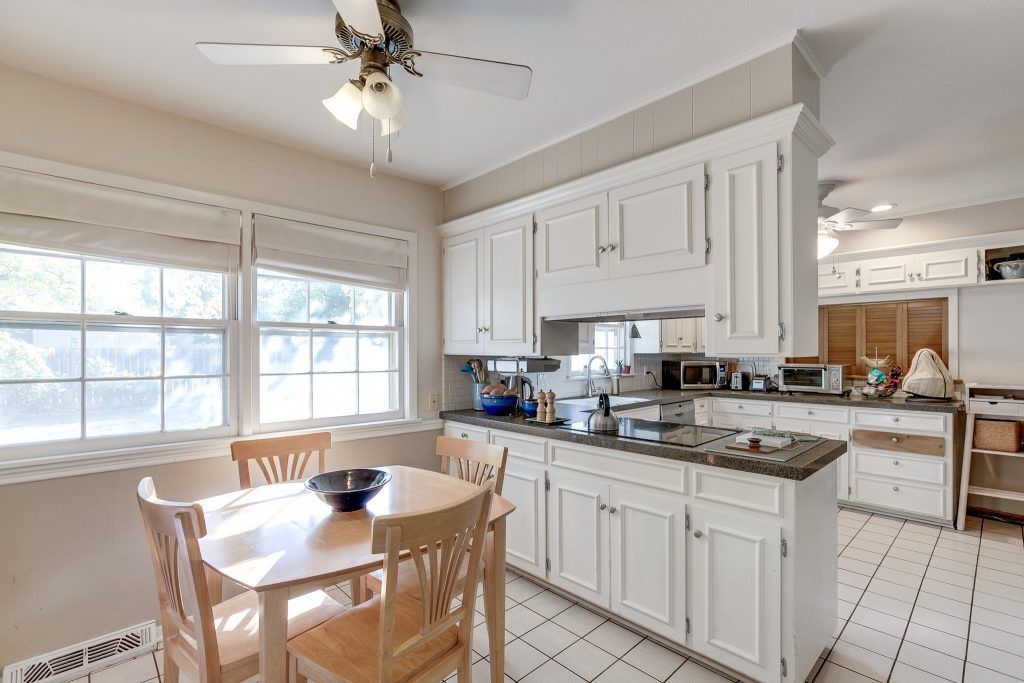 Minimalist kitchen with grey cabinets